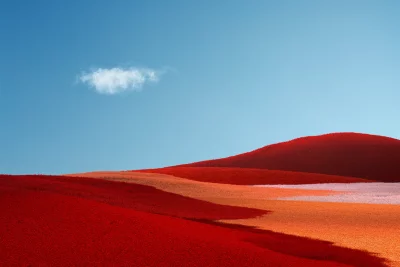 Vibrant Abstract Rolling Hills Landscape Under Blue Sky image