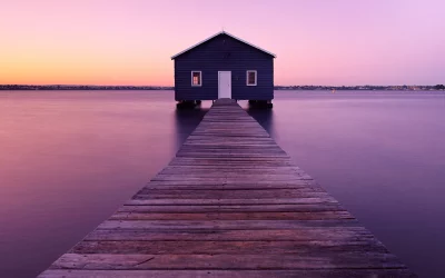 Iconic Blue Boathouse on Wooden Jetty at Serene Sunset in Perth image