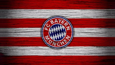 Iconic FC Bayern Munich Logo on Rustic Austrian Flag Wood Background image