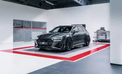 Sleek Grey ABT Audi RS6 Avant High-Performance Luxury Sportscar in Modern Workshop Setting image