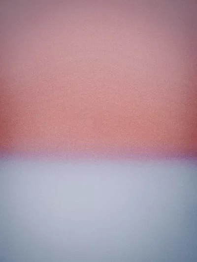 Soft Gradient Background with Subtle Pink and Blue Hues and Fine Grain Texture