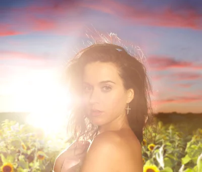 Captivating Katy Perry Portrait with Golden Sun Flare in Radiant Sunflower Field image