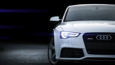 Dynamic White Audi RS5 Luxury Sportscar with Glowing LED Headlight at Night image