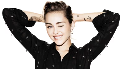 Playful Young Woman with Short Hair Winking in Star-Adorned Black Shirt image