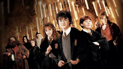 Beloved Harry Potter characters pose in the enchanting Great Hall with floating candles image