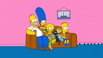 The Simpsons Family Gathered on a Brown Sofa Watching Television image