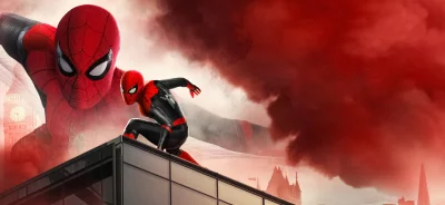 Spider-Man's heroic stance on London rooftop against dramatic red sky. image
