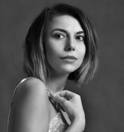Classic black and white portrait of a young woman with pensive gaze image
