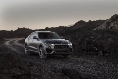 Sleek Black Maserati Levante SUV in Rocky Off-Road Landscape image