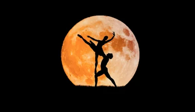Ballet Dancers Silhouette Performing Against Vibrant Full Moon Night Sky image