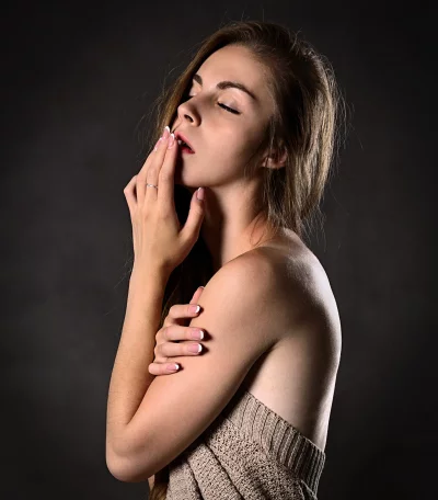 Elegant Woman's Sensual Portrait with Closed Eyes and Delicate Hands image