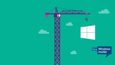 Crane Lifting Windows Logo into Place Representing System Development and Updates image