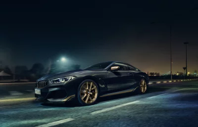 Dynamic BMW M850i Gran Coupe with Gold Accents Night Drive image