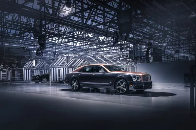 Exclusive Two-Tone Luxury Sedan in Modern Industrial Showroom image