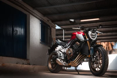Sleek Red Honda CB650R Motorcycle Parked in Urban Industrial Garage image