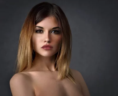 Expressive Young Woman with Ombre Hair and Piercing Gaze Portrait image