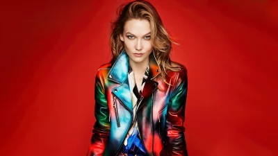 Captivating Woman in Vibrant Airbrushed Leather Jacket on a Bold Red Background image