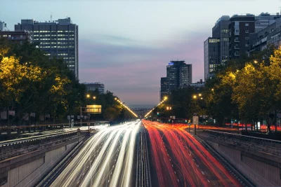 Dynamic Urban Highway Traffic with Vibrant Light Trails at Dusk image