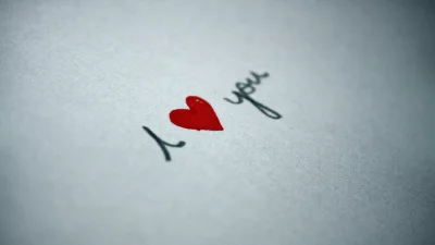 Heartfelt Handwritten 'I Love You' Message on Simple White Textured Paper image