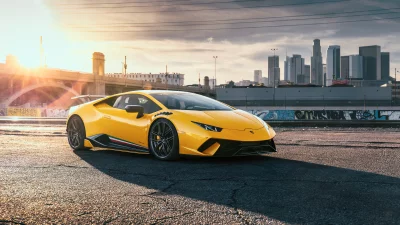 Yellow Lamborghini Huracan Supercar Parked in Urban Los Angeles Cityscape at Sunset image