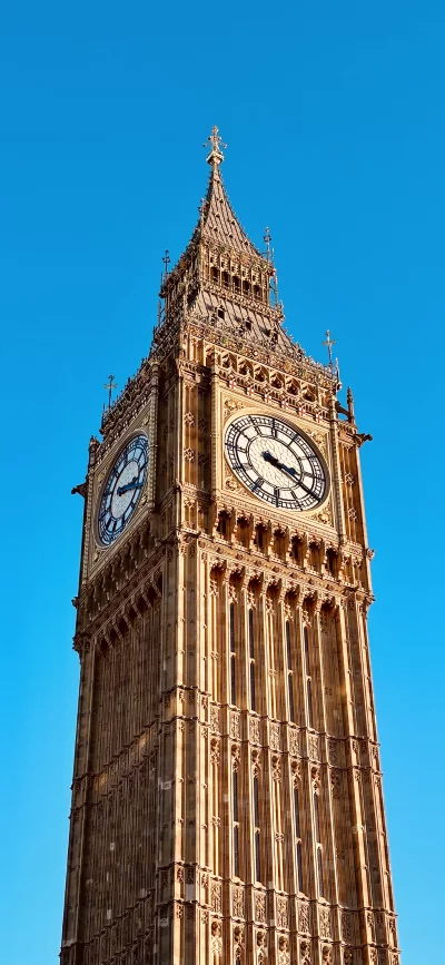 Iconic Big Ben Clock Tower Against a Clear Blue Sky in London