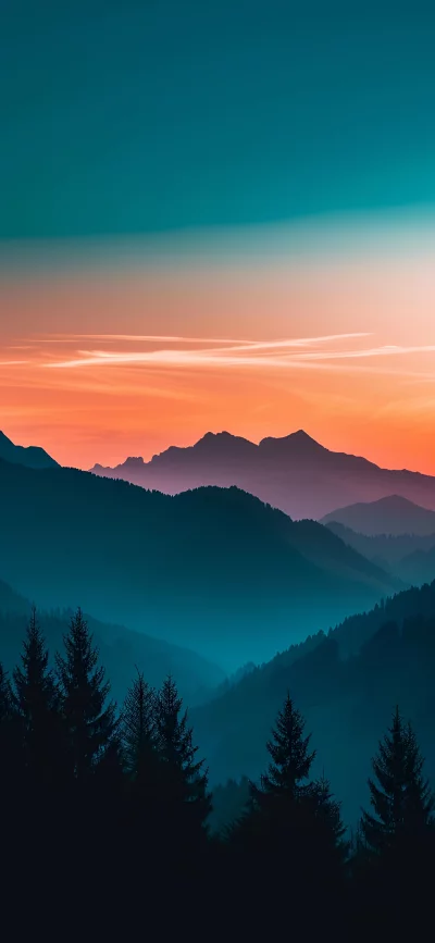 Misty Mountain Range at Dusk with Fiery Sunset Sky