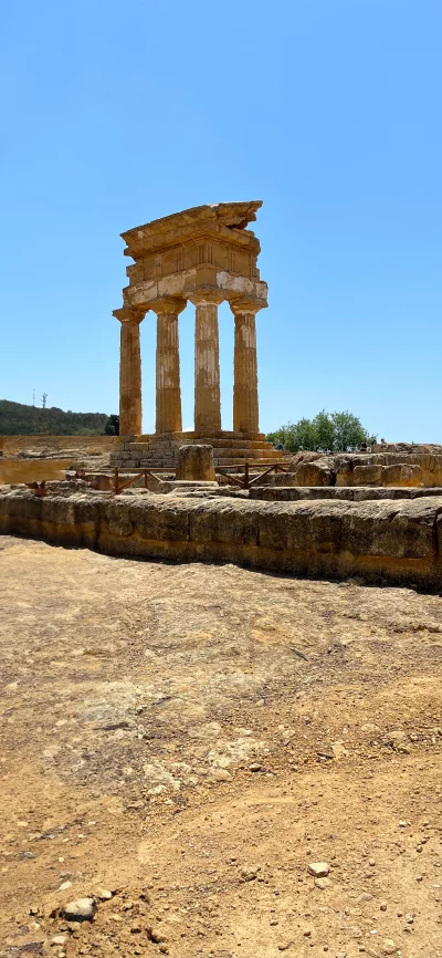 Ancient Greek Temple Ruins Under Clear Blue Sky - Historical Landmark