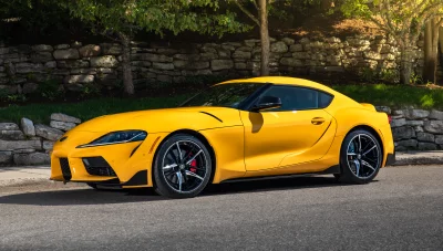 Vibrant Yellow Toyota Supra Sports Car Parked on Sunny Road image