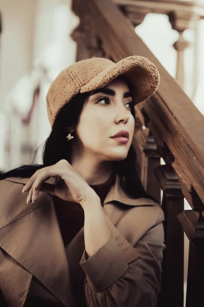 Stylish Woman in Brown Trench Coat and Teddy Cap