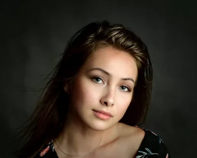 Captivating Young Woman with Light Green Eyes and Flowing Hair image