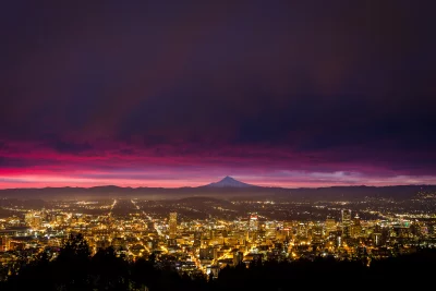 Vibrant City Skyline at Dusk with Mount Hood and Dramatic Pink Sky image