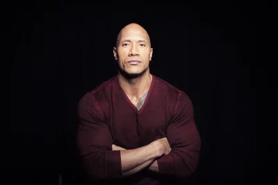 Powerful Dwayne Johnson Portrait with Arms Crossed in Red Sweater image