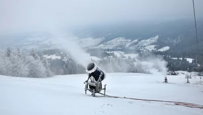 Snowmaking Cannons on Polish Mountain Ski Slope with Misty Winter Landscape image