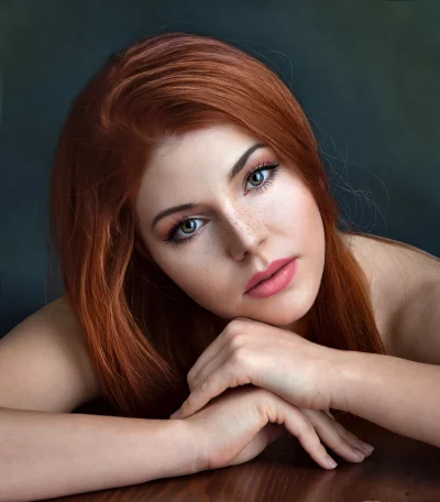 Captivating Redhead Woman with Freckles and Piercing Green Eyes image