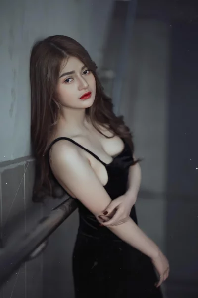 Beautiful girl is looking at the camera with a serious expression