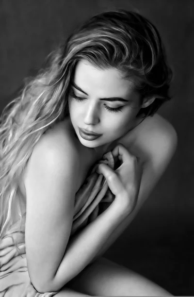 Pensive Young Woman with Long Hair and Closed Eyes in Black and White Portrait image