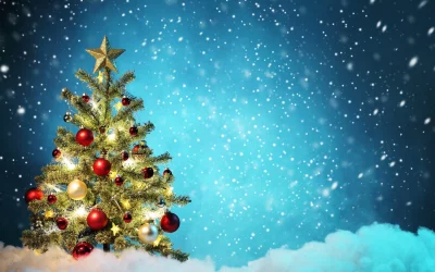 Festive Christmas Tree Adorned with Lights and Ornaments Under Snowy Sky image