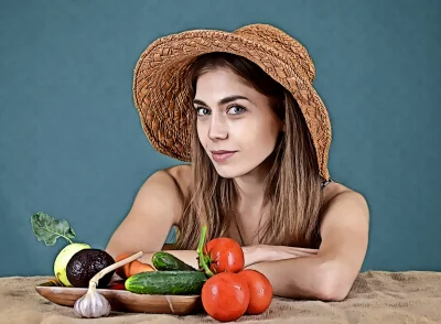 Farm Girl in Straw Hat Posing with Organic Garden Vegetable Harvest image