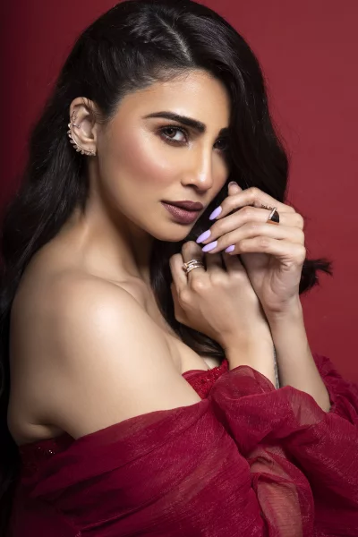Beautiful Woman Posing in Elegant Red Dress with Glamorous Makeup and Jewelry image