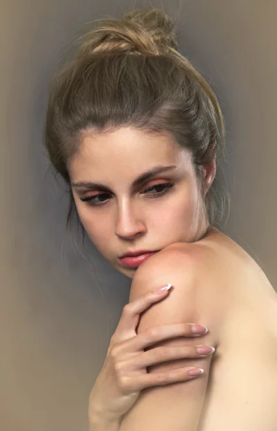 Pensive Young Woman with Messy Bun Natural Beauty Portrait image