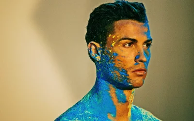 Captivating Portrait of Cristiano Ronaldo in Blue and Yellow Powder Art image