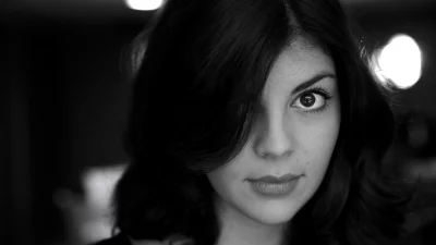 Intense Black and White Portrait of a Young Woman with a Piercing Gaze image