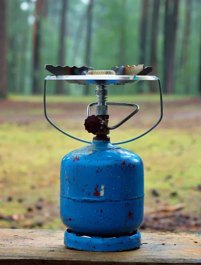 Compact Portable Camping Gas Stove with Blue Canister for Outdoor Cooking image