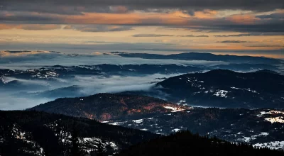 Ethereal Winter Mountain Panorama with Golden Hour Cloud Inversion image