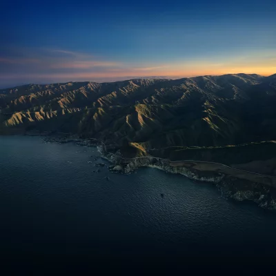 Dramatic Coastal Sunset over Big Sur Mountains and Iconic Arch Bridge image