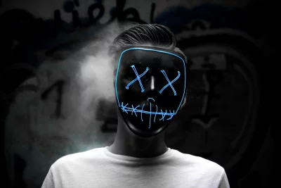 Cyberpunk Portrait: Person in Glowing Neon Mask and Smoke image