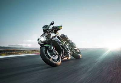 High-Performance Motorcycle Cornering with Speed on Racetrack, Vibrant Sunflare image