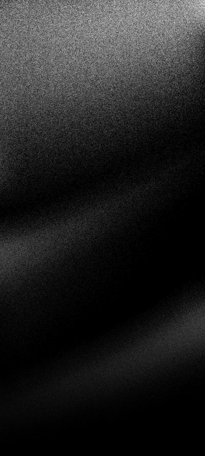 Abstract grainy black and white background with diffused light