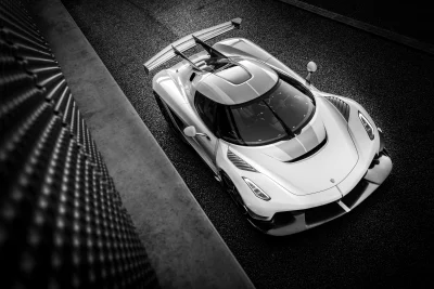 Sleek Monochrome Hypercar on Asphalt Track: High-Performance Automotive Design image