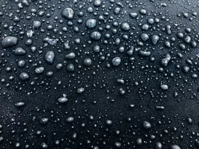 Water Droplets on Dark Textured Surface, Liquid Condensation Macro Background image